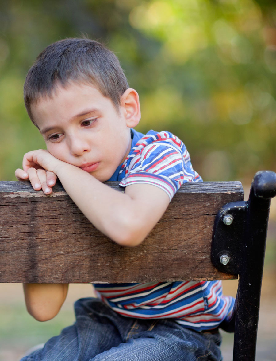 young boy bench depressed